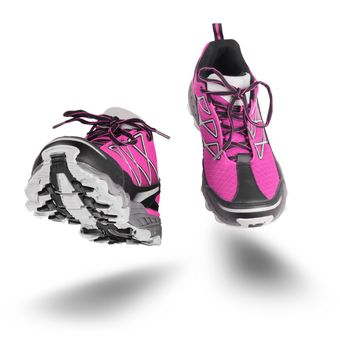 Pink running sport shoes seen front, isolated on white background