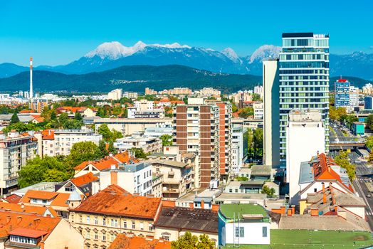 Panorama of Ljubljana with modern architecture and the beautiful Alps on the background