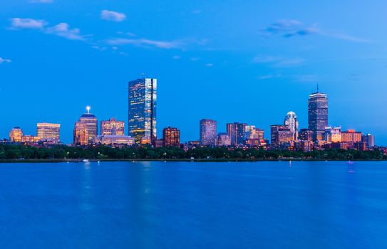 Boston cityscape. Panorama of Back Bay at dusk. View from Cambridge across The Charles River, Massachusetts, USA