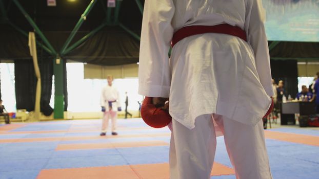 Preparing for duel karate of two teenagers at the championship