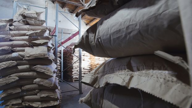 The large warehouse with packs of pasta at the macaroni manufacturing, close up