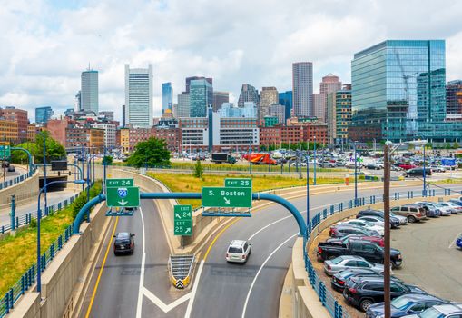 Boston - June 2016, MA, USA: Boston skyline in summer day, panoramic view on buildings in downtown and highway with traffic