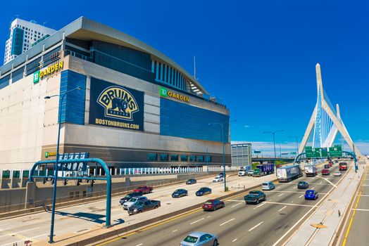 Boston - June 2016, MA, USA: View of TD Garden, Leonard P. Zakim Bunker Hill Bridge and highway with traffic in sunny summer day with clear blue sky