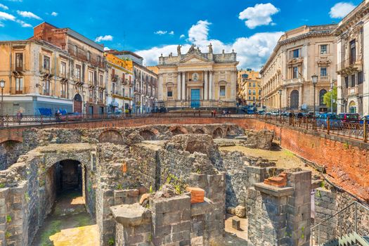 Catania - April 2019, Sicily, Italy: The Ruins of an ancient Roman theater and The Church of San Biagio (Chiesa San Biagio in Sant'Agata alla Fornace)