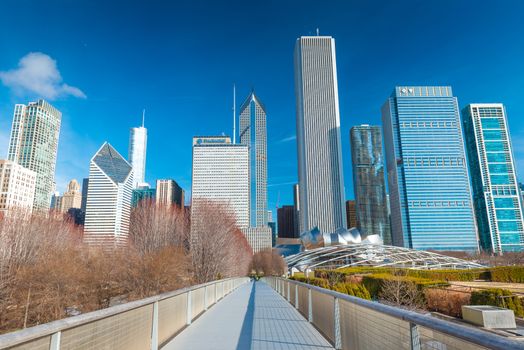 Chicago - March 2017, IL, USA: View of skyscrapers and office buildings in downtown Chicago. Nichols Bridgeway in Millennium Park
