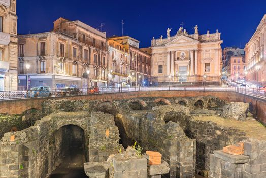 Catania - April 2019, Sicily, Italy: Night view of the Roman Amphitheater of Catania, ruins of an ancient theater in the famous Sicilian city