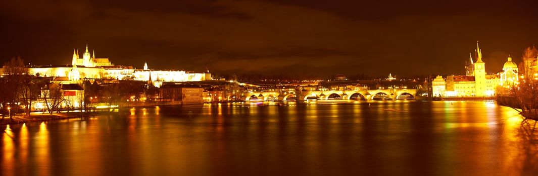 Night view of historical Prague with the Prague castle and Charles bridge