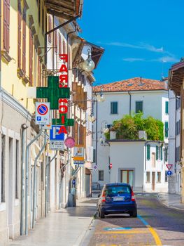 Udine - August 2016, Italy: Street view with car parked near the Pharmacy store