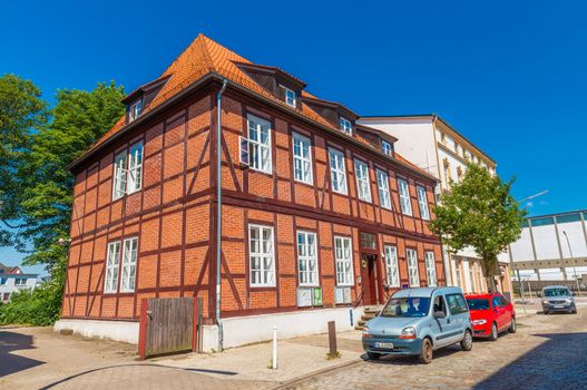 Harburg - July 2018, Germany: A house in the traditional German architecture style. Building made of red brick with clay tiles on the roof
