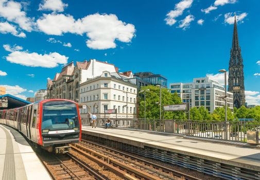 Hamburg - July 2018, Germany: Metro train is arriving at one of the stations in downtown Hamburg (Rodingsmarkt)