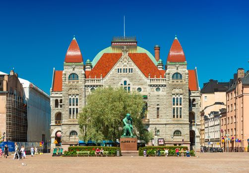 Helsinki - June 2019, Finland: Building of the Finnish National Theatre and the Statue of Aleksis Kivi