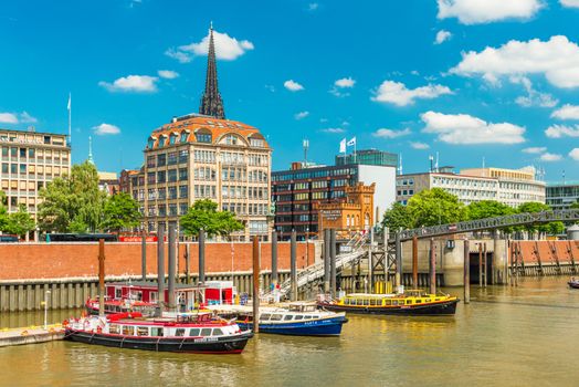 Hamburg - July 2018, Germany: Colored boats on the water. Cityscape of downtown Hamburg