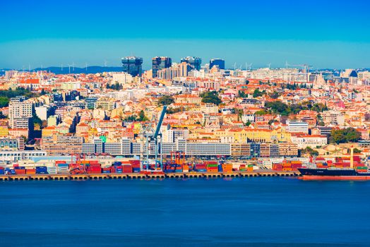 Lisbon - January 2019, Portugal: Picturesque panorama of Lisbon. View of a port with shipping containers, cranes and tanker