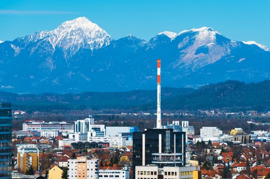 Ljubljana - March 2017, Slovenia: Ljubljana cityscape with snowy mountains on the background