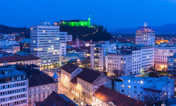 Ljubljana - March 2016, Slovenia: Night view of the Slovenia's capital. Office buildings and the old Ljubljana's Castle on the hill. Main landmark of the city.