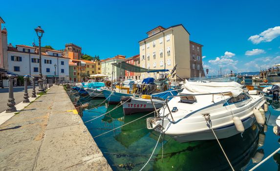 Muggia - July of 2014, Italy: Boats in harbor of the old city center in Muggia