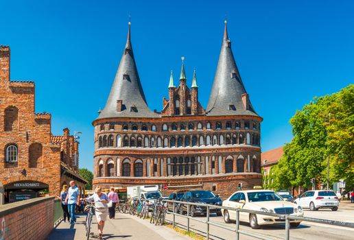 Lubeck - July 2018, Germany: The Holsten Gate (Holstentor). One of the famous landmarks of the old gothic town. Popular tourist destination, Schleswig-Holstein region