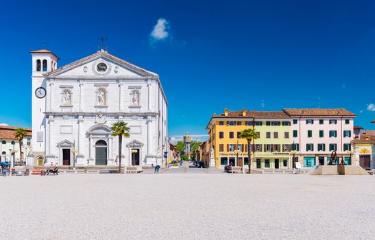 Palmanova - April 2016, Italy: Central square in The Fortress Town of Palmanova, view on Cathedral and colored houses in traditional architecture style