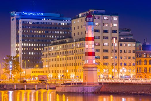 Malmo - October 2018, Sweden: Evening cityscape of Malmo with the Old Light House, the University Bridge (Universitetsbron) and office buildings on the background