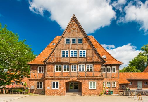 Luneburg - July 2018, Germany: Old brick half-timbered house in the traditional German architecture style. Facade of a historical building in a small European town