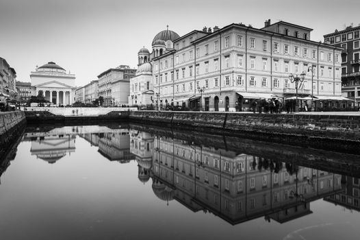 Trieste - December 2016, Italy: Mirror reflected historic buildings in the water canal situated in the center of the city, the famous landmark in Trieste (Northern Italy)