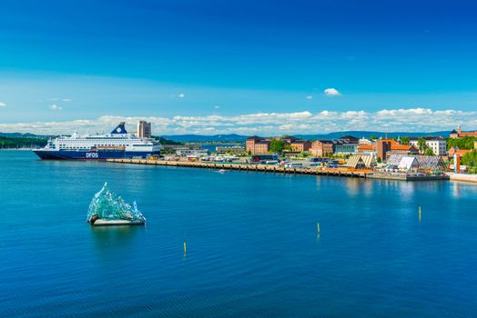 Oslo - June 2019, Norway: Beautiful aerial cityscape of the capital of Norway. Skyline with a cruise ship, modern sculpture and historical architecture