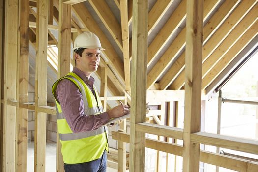 Building Inspector Looking At New Property