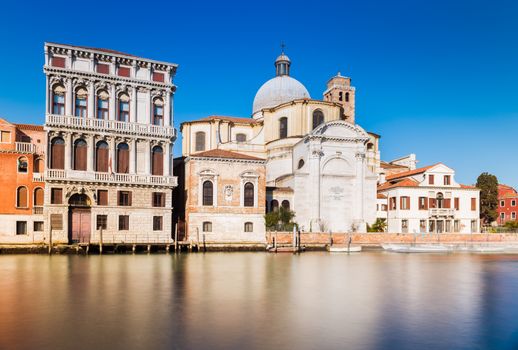 Venice - January 2017, Veneto, Italy: The street of Venice, old houses and San Geremia church (Chiesa di San Geremia e Lucia) reflected in the water of Grand Canal, famous landmark in the city