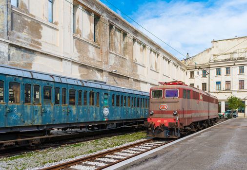 Trieste - March 2016, Italy: Electric locomotive and old train cars in Railroad Museum (Museo Ferroviario di Trieste), one of the landmarks in the capital of Friuli Venezia Giulia region