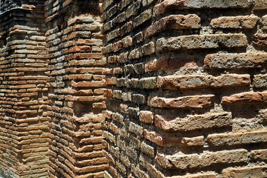 A fragment of a brick wall in the ruins of  the ancient Roman city of Gortyna on the island of Crete in Greece