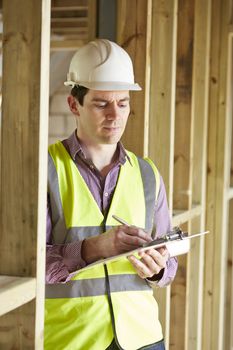 Building Inspector Looking At New Property