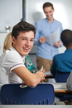 Portrait Of Male Teenage Pupil In Class