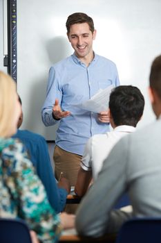 Teacher Talking To Pupils In Class