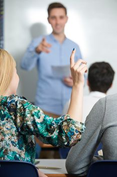 Female Pupil Answering Question In Class