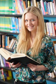 Female Student Studying In Library