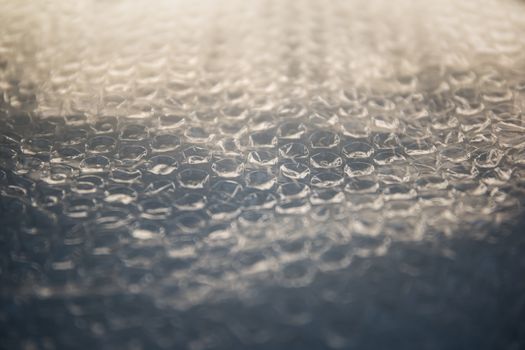 Bubble wrap sheet shot in selective focus with light effect