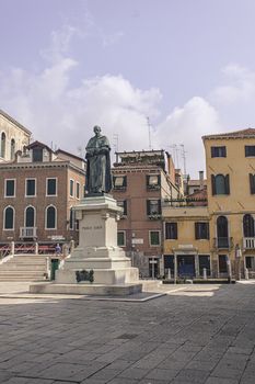 Paolo Sarpi statue in Venice and other historic building behind