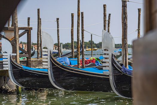 Details of Gondolas moored in Venice ready for a touristic trip