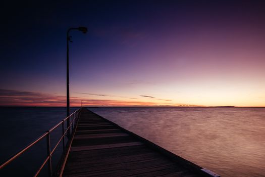 The iconic Rye Pier on a cool winter's morning at sunrise on the Mornington Peninsula in Melbourne, Victoria, Australia