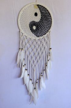 White and black dream catcher Yin Yang. Knitted Indian amulet.