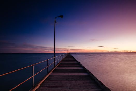 The iconic Rye Pier on a cool winter's morning at sunrise on the Mornington Peninsula in Melbourne, Victoria, Australia