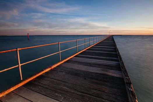 The iconic Rye Pier on a cool winter's morning at sunrise on the Mornington Peninsula in Melbourne, Victoria, Australia