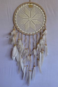 White color dream catcher with white feathers in the interior. Home Decor Concept..