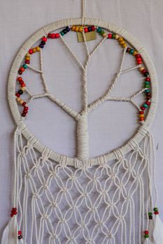 White dreamcatcher - Indian amulet that protects the sleeper from evil spirits and diseases.. The tree - symbol of life. White background.