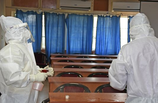 Burdwan Town, Purba Bardhaman District, West Bengal / India - 24.06.2020: Health workers are collecting samples of asymptomatic journalist for COVID-19 (Novel Coronavirus) test in the initiative of Purba Bardhaman District Health Department.