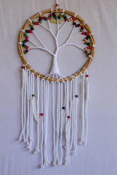 White dreamcatcher - Indian amulet that protects the sleeper from evil spirits and diseases.. The tree - symbol of life. White background.