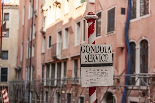 Gondola service sing detail in Venice in italy in a sunny day