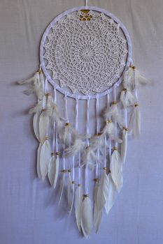 White color dream catcher with white feathers in the interior. Home Decor Concept..