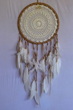 White color dream catcher with white feathers in the interior. Home Decor Concept..