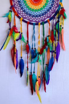 Beautiful multicolored handmade dreamcatcher on white background.